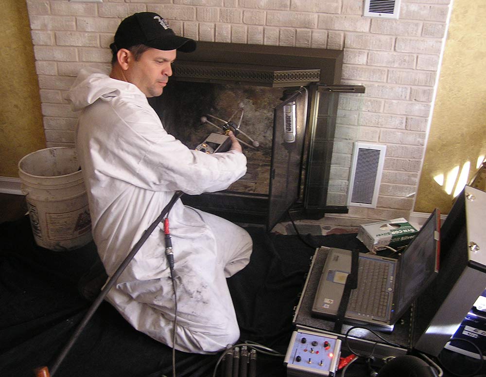 man working on fireplace