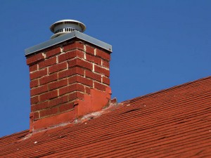Red Brick Masonry Chimney Atop Roof of House - Cherry Hill NJ - Mason's Chimney Service