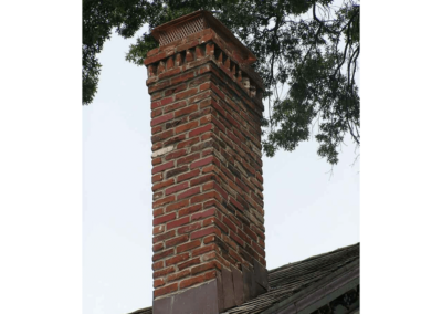 Completed masonry repair with new custom masonry crown and copper chimney cap