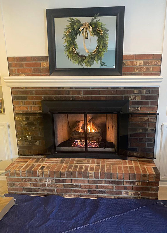 Mason's Chimney- Original of Ahren-Fire and Ventis Cord Oak gas logs Ahren-Fire and Ventis Cord Oak gas logs lit fireplace